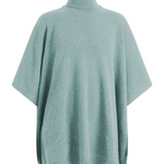 A light blue turtleneck cashmere poncho with cut sides | Angela | Linnea Lund