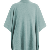 A light blue turtleneck cashmere poncho with cut sides | Angela | Linnea Lund